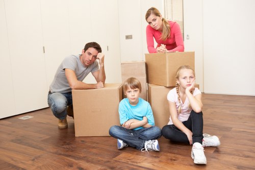 Professional movers carrying furniture in Fulham
