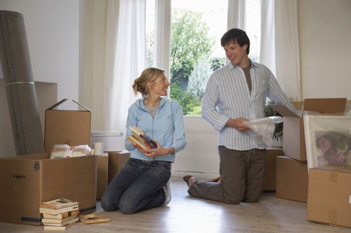 Professional movers handling furniture in a Fulham home