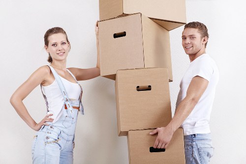 Careful packing and labeling of boxes for a flat move in Fulham
