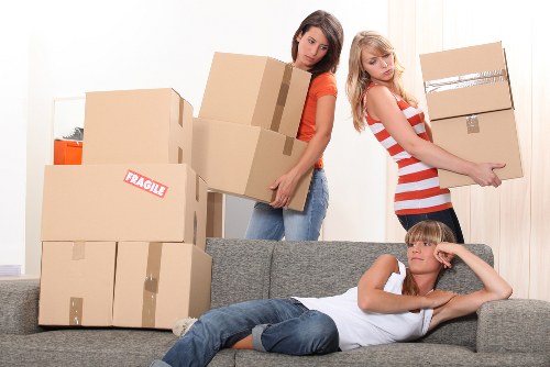 Organised moving day for flat removals in Fulham with boxes and furniture