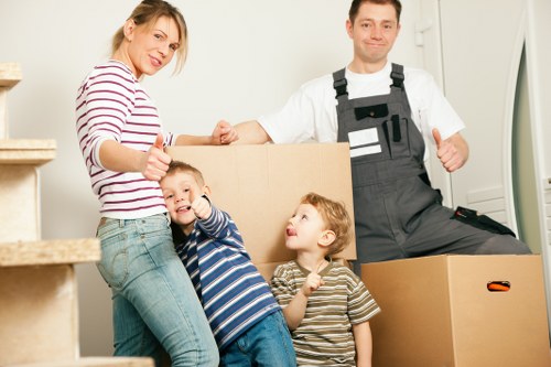 A removal team loading household items for a move in Fulham